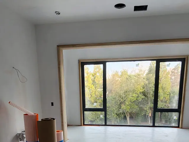 New drywall and interior finishing prepared for final flooring.