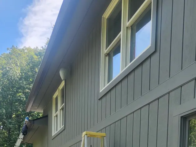 Freshly painted exterior siding and window trim.