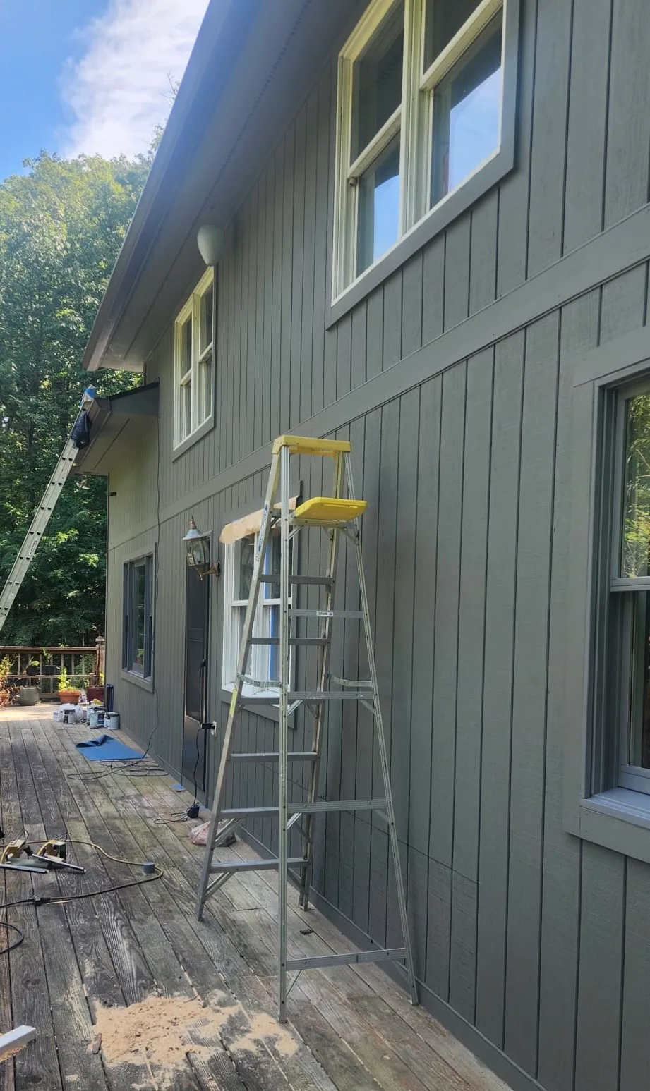 Freshly painted exterior siding and window trim.