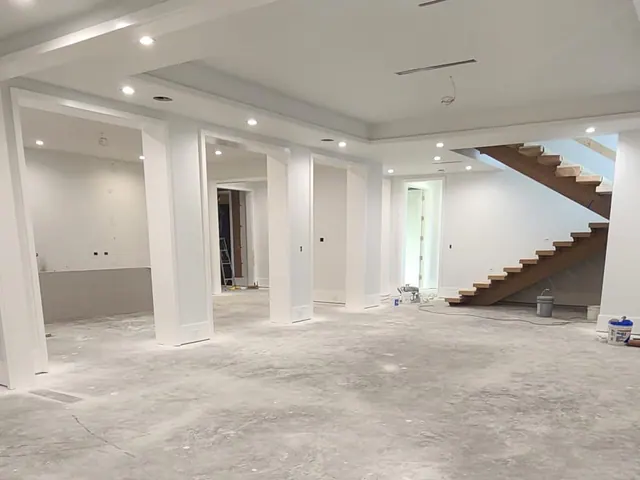 Large interior renovation with finished walls and recessed lighting.