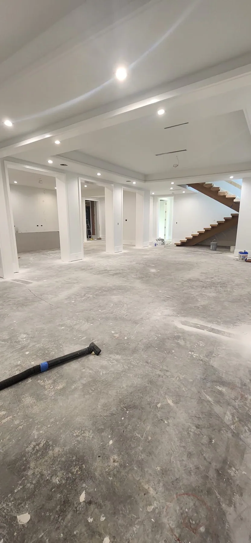 Large interior renovation with finished walls and recessed lighting.