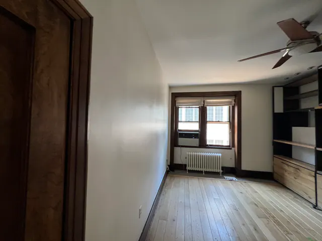 Freshly painted living room with natural wood trim.